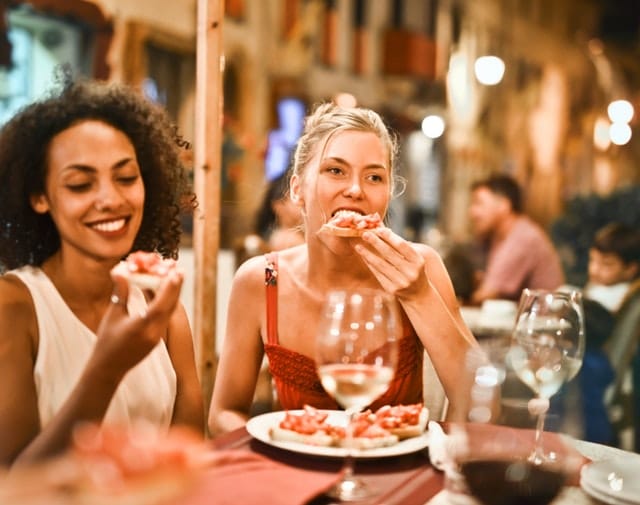 women eating at an office party