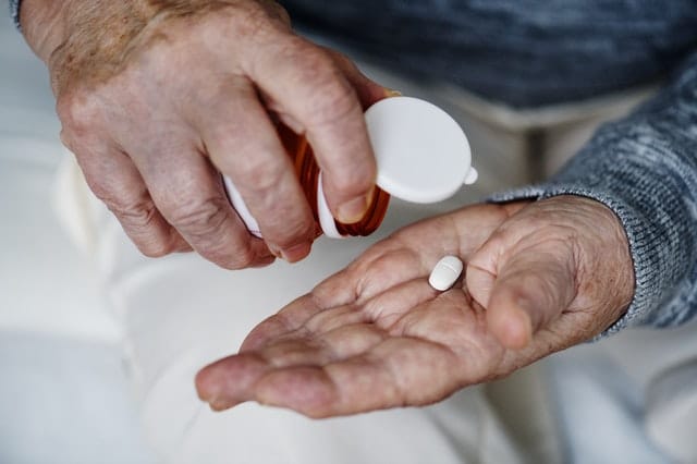 Man taking his medication. 