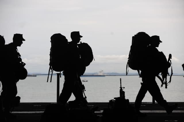 Soldier marching with backpacks 