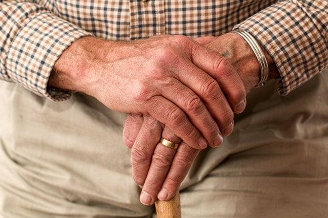 Physicians leaning on a cane 