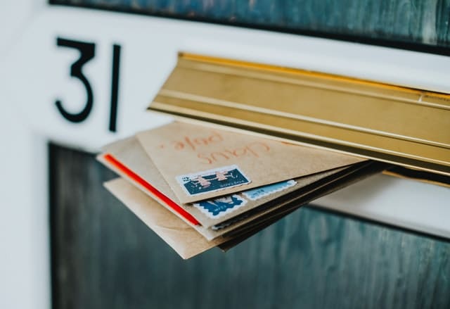 envelopes in a door