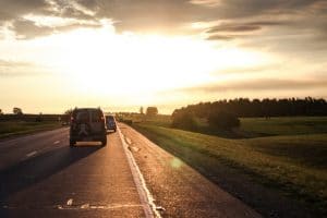 Car driving down a rural highway 