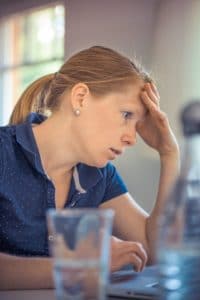 Woman looking annoyed at work 