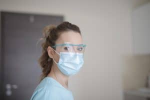 woman-in-blue-shirt-wearing-face-mask-3881247