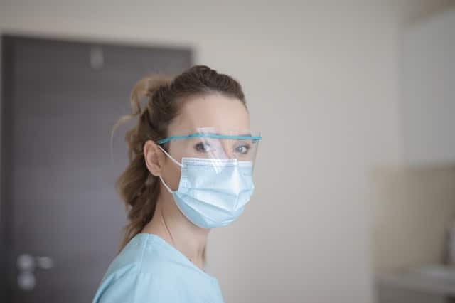 woman-in-blue-shirt-wearing-face-mask-3881247